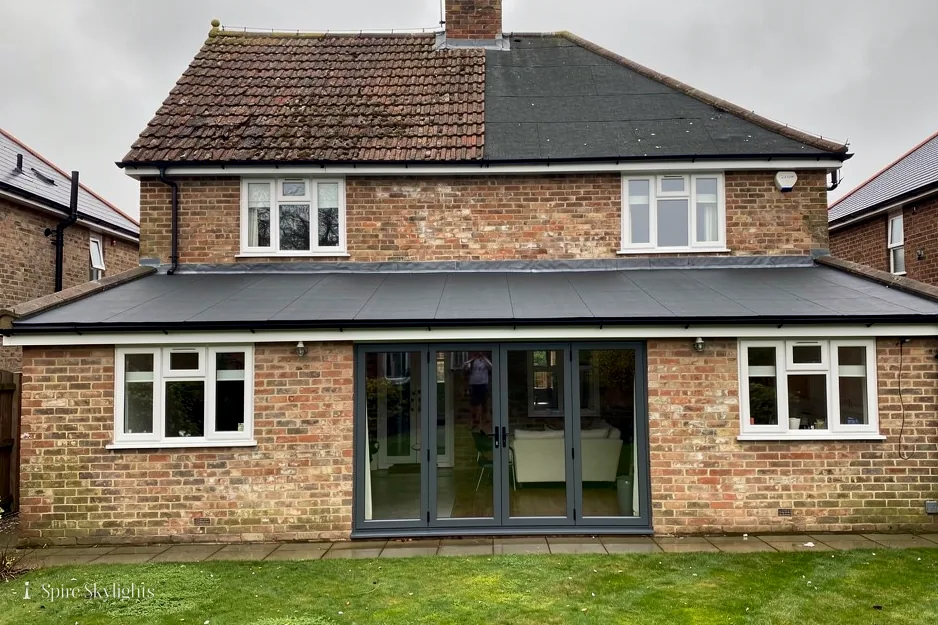 Brick semi with a flat-roof rear extension and wide garden doors