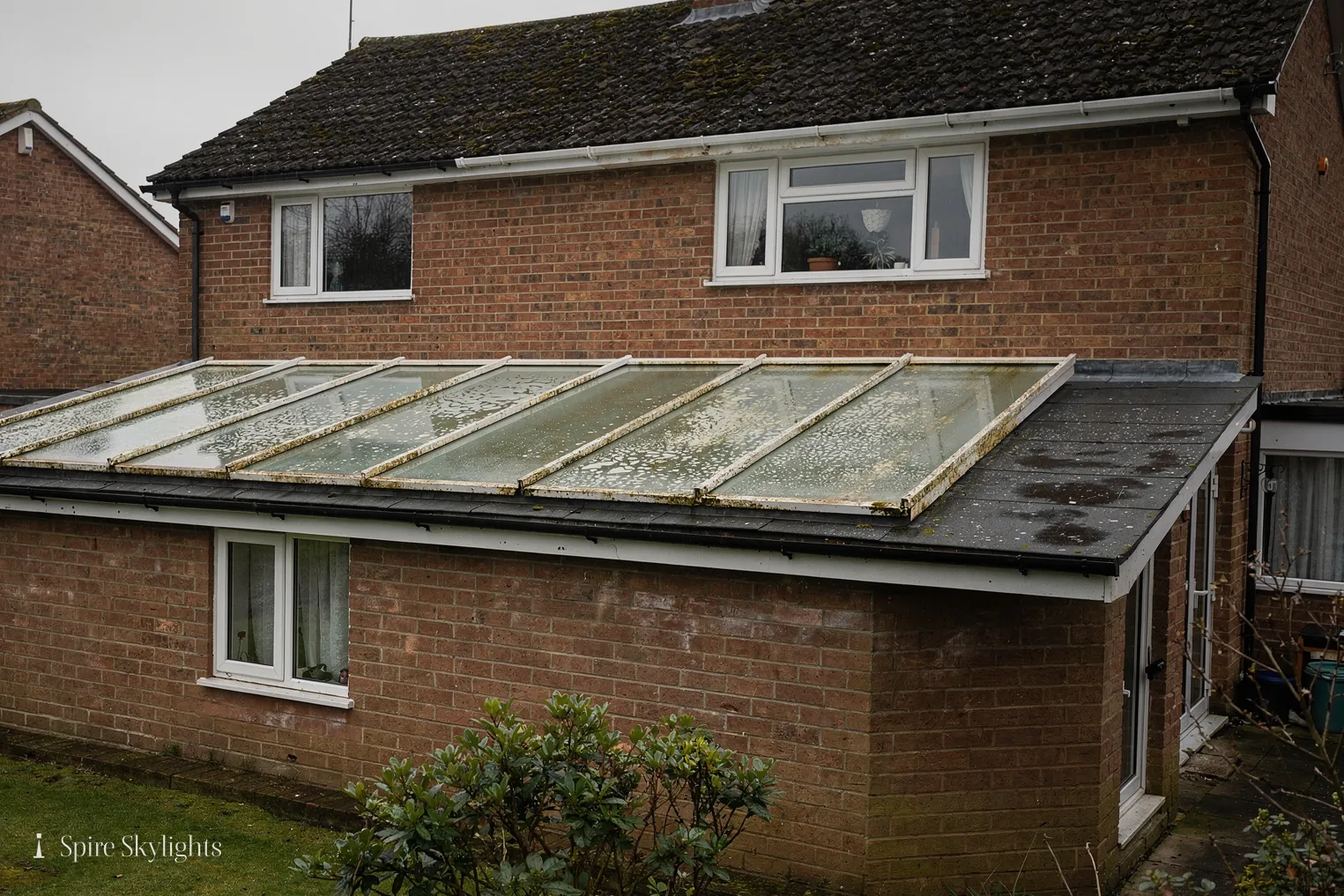 Old weathered glazed roof on a rear extension, ready to be replaced