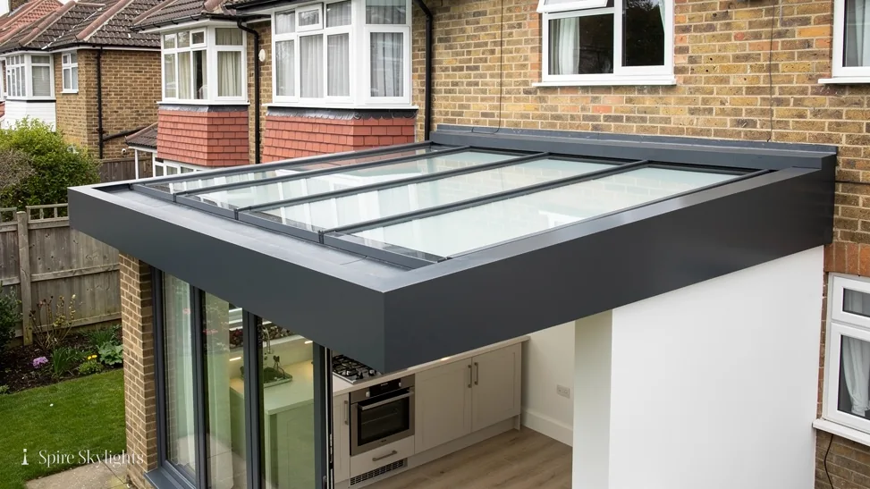 Brick semi with a frameless glass roof over its single-storey extension