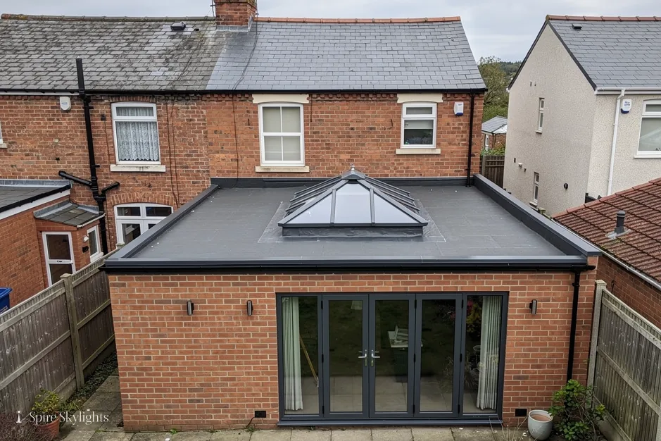 Roof lantern on the flat roof of a brick rear extension behind a terrace