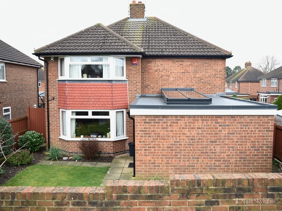 Brick semi with a flat-roof rear extension and a rooflight
